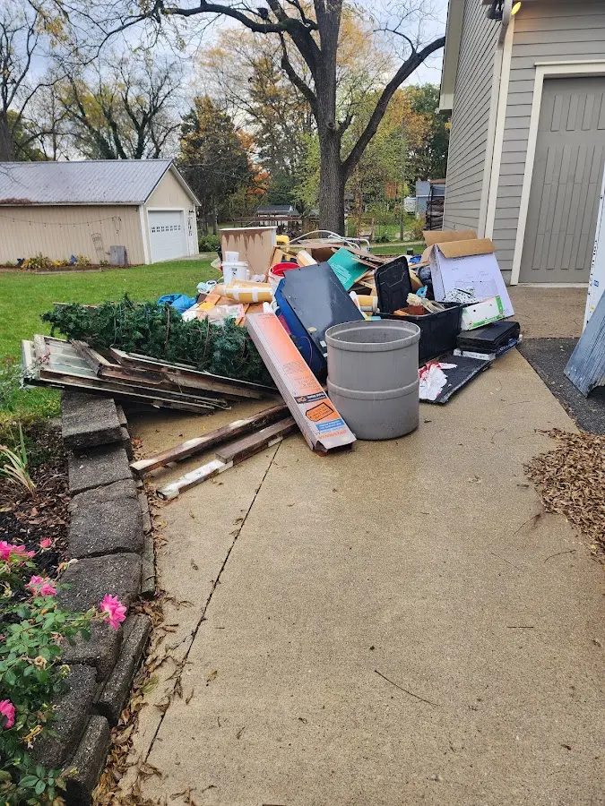 Dumpster being loaded with debris for Residential Dumpster Rental in Burbank